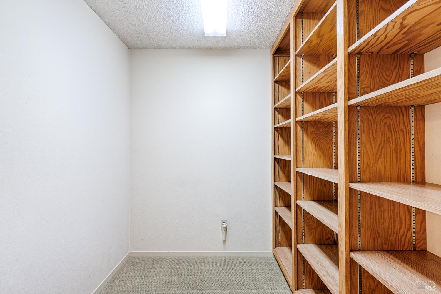 138 Oak Shadow Drive Santa Rosa, CA 95409 - Photo 25 of 50 a view of walk in closet with empty racks