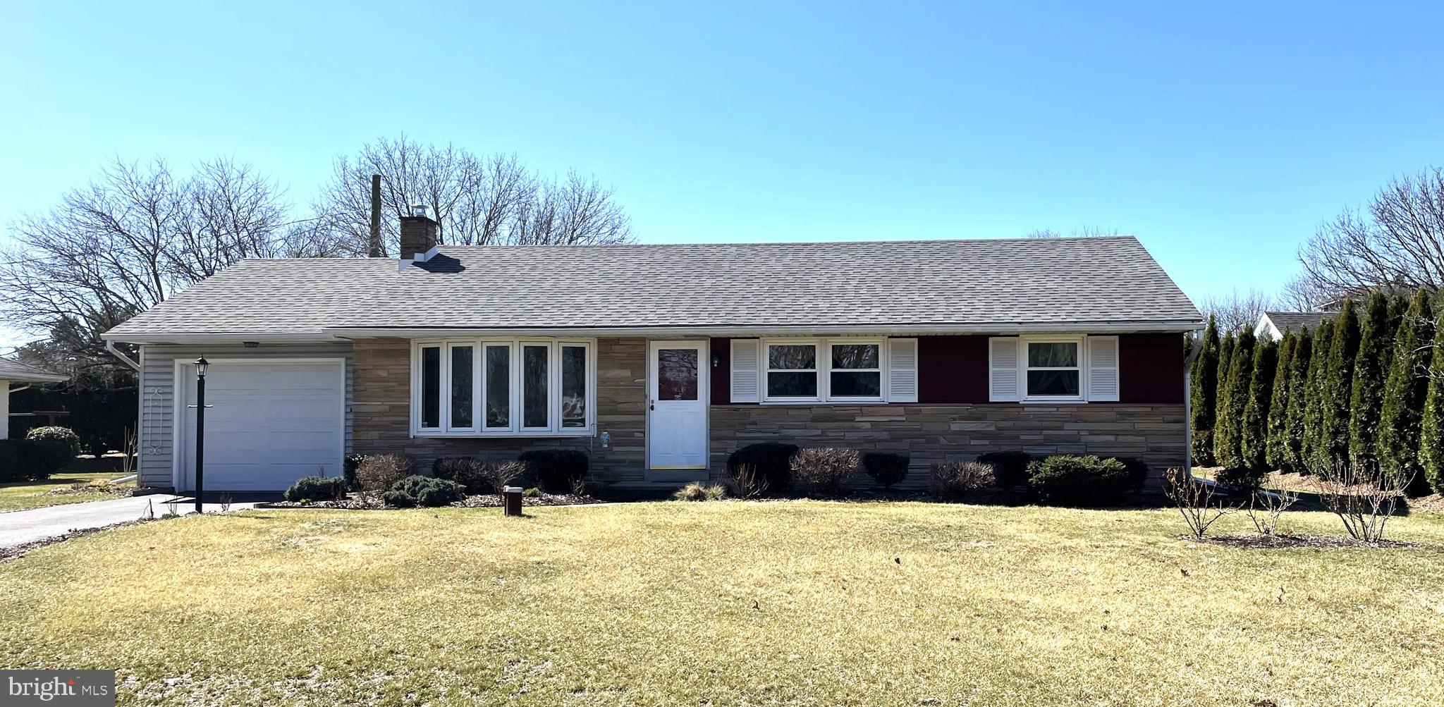 3934 Union Avenue Schnecksville, PA 18078 - Photo 1 of 14 a front view of a house with a yard covered with snow and trees