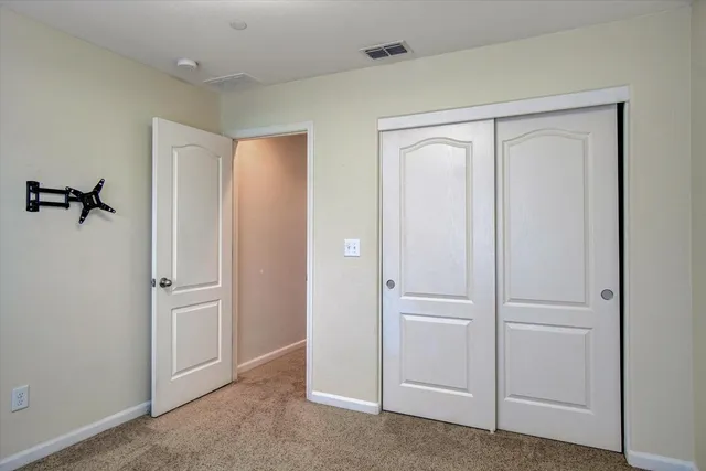 a view of a hallway with paintings on the wall