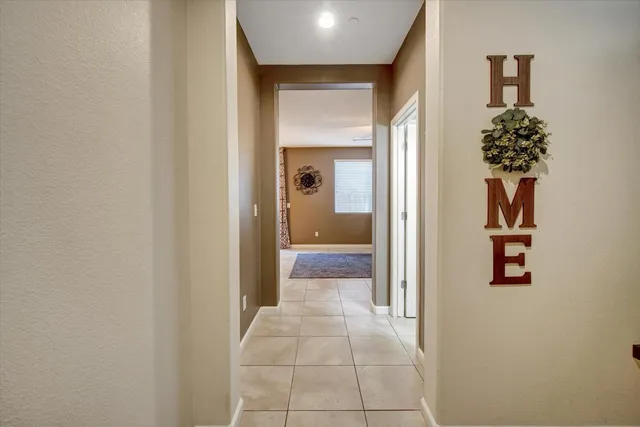 a view of a hallway with a flower pot