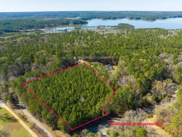 a view of a garden with an outdoor seating