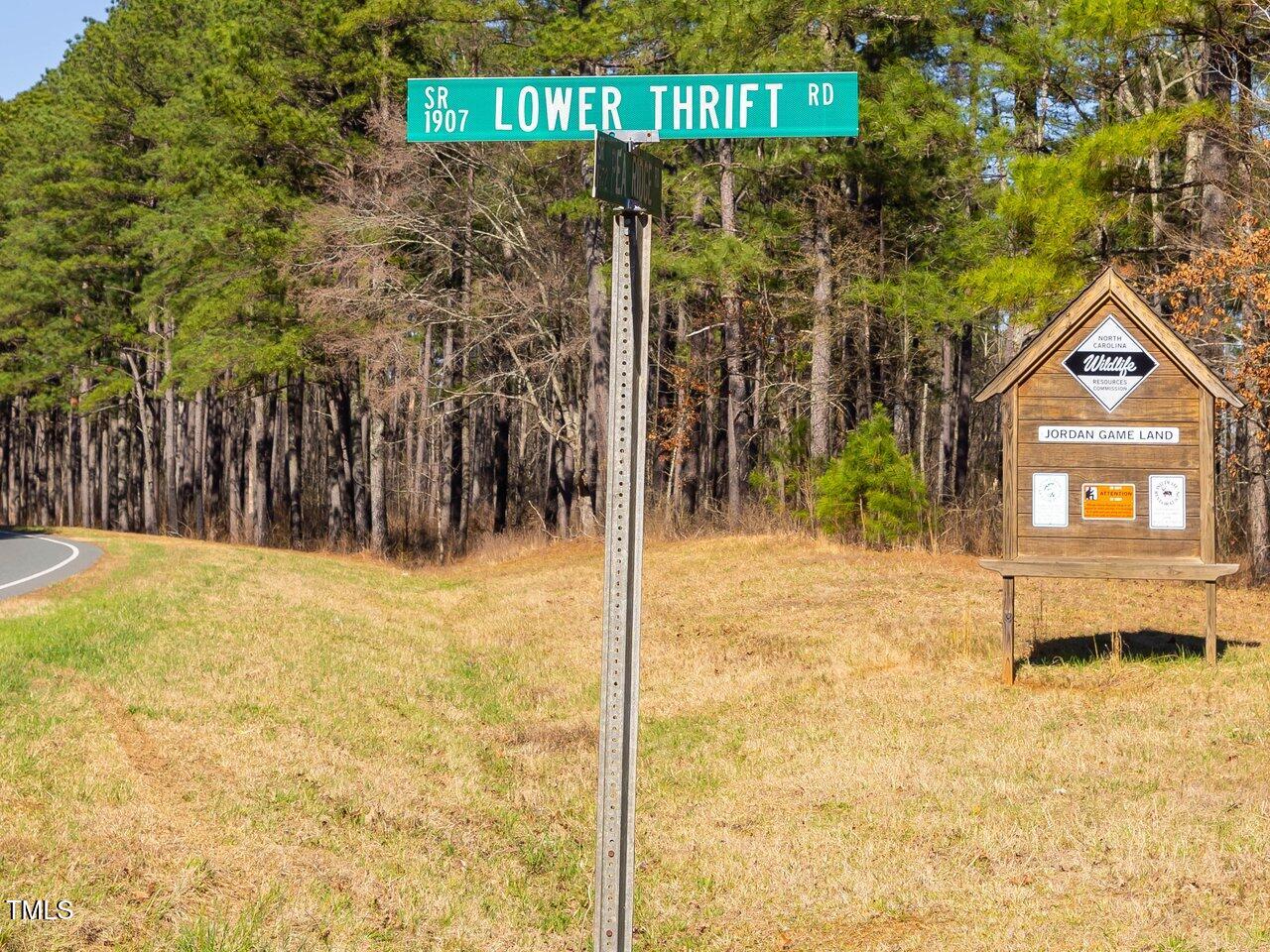 422 Lower Thrift Road New Hill, NC 27562 - Photo 2 of 14 a front view of a house with a yard