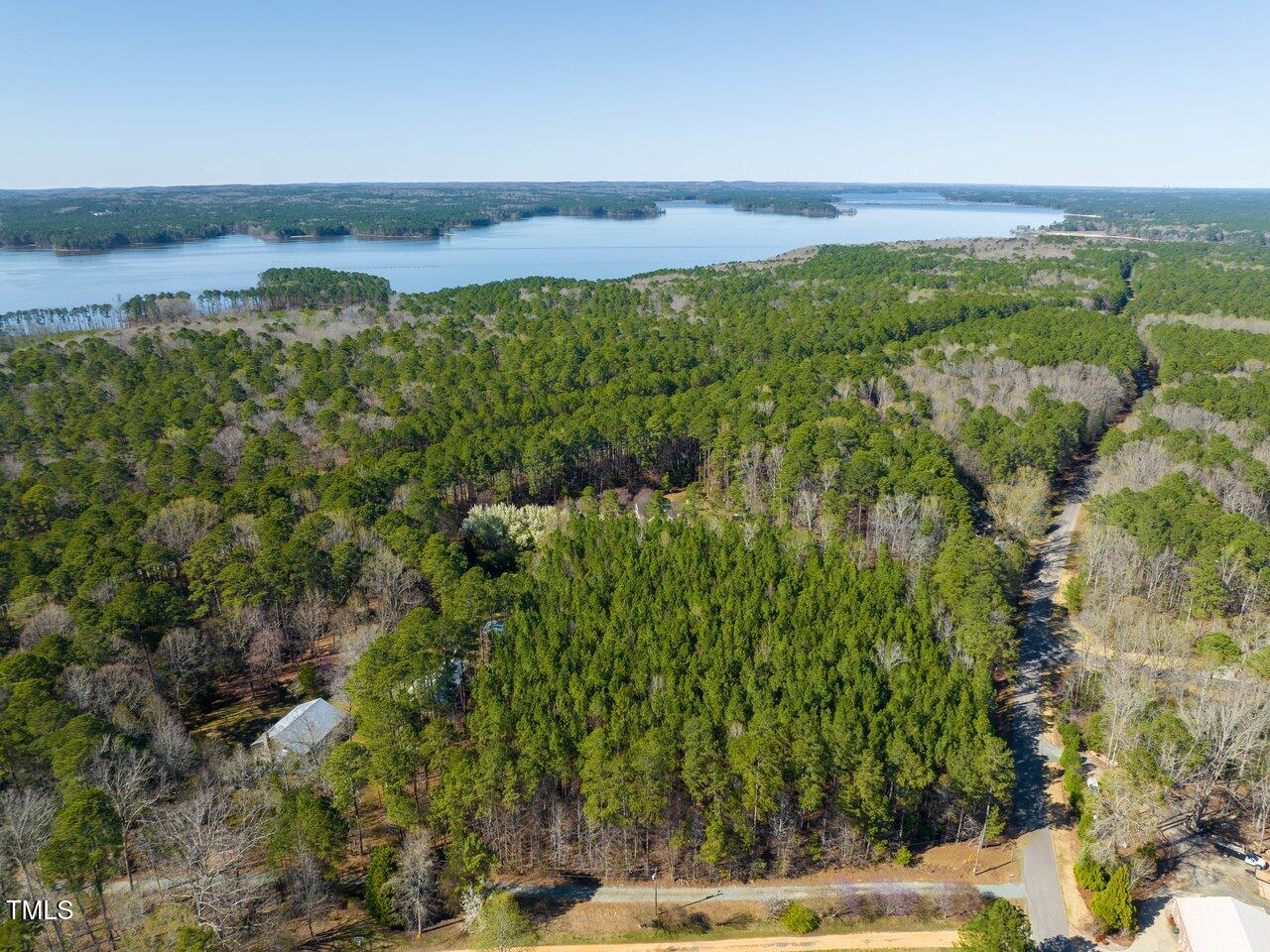 422 Lower Thrift Road New Hill, NC 27562 - Photo 5 of 14 a view of a lake with a yard