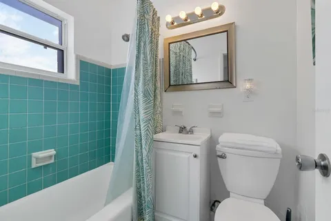 a bathroom with a toilet a sink and bathtub