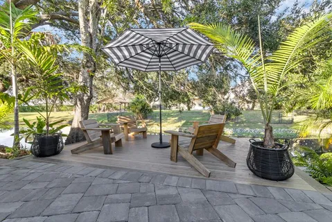 a view of a chairs and table in the patio