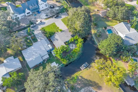 an aerial view of a house with a yard and a garden