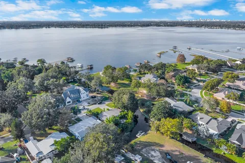 an aerial view of a houses with a lake view