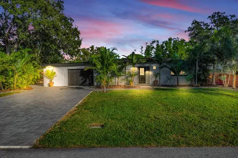 a house view with outdoor space and garden