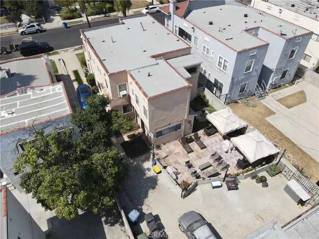 an aerial view of residential house with parking