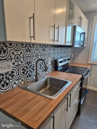 a kitchen with a stove and a sink