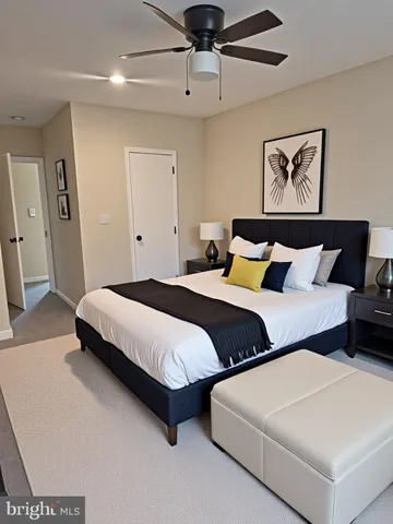 a bedroom with two beds and painting on the wall