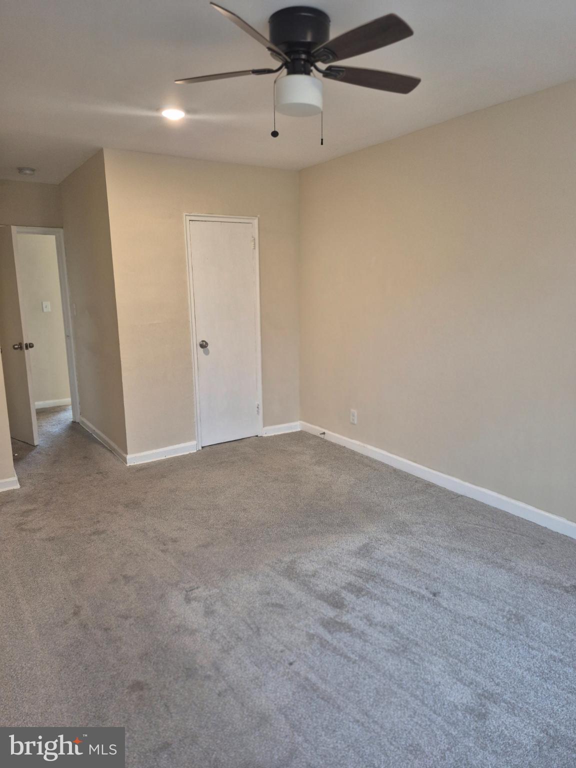 512 Ridge Road Southeast, Unit 305 Washington, DC 20019 - Photo 10 of 10 an empty room with a ceiling fan and window