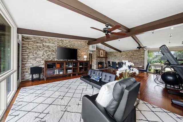 a view of a livingroom with furniture and a flat screen tv
