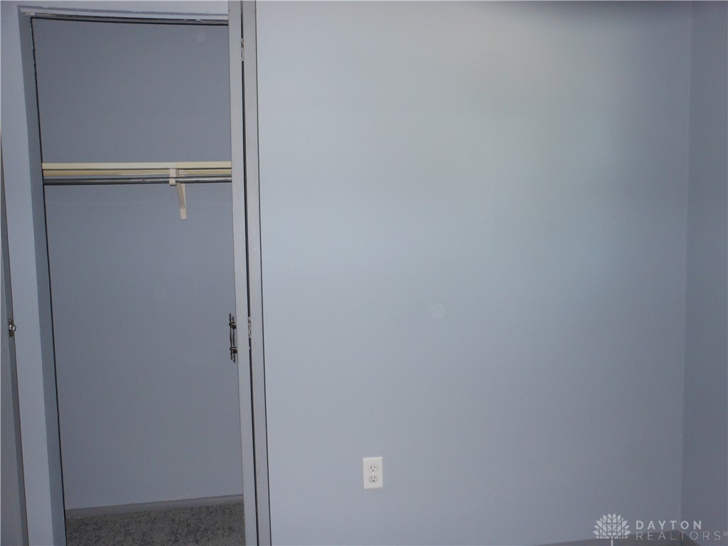 143 West Emerick Road West Milton, OH 45383 - Photo 23 of 37 This interior offers a well-appointed closet, providing ample storage within a comfortable living space.