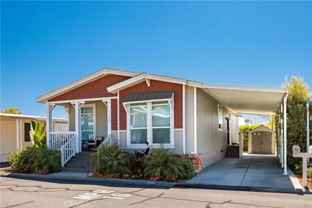 front view of a house with potted plants
