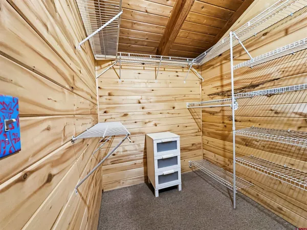 a view of a patio with table and chairs