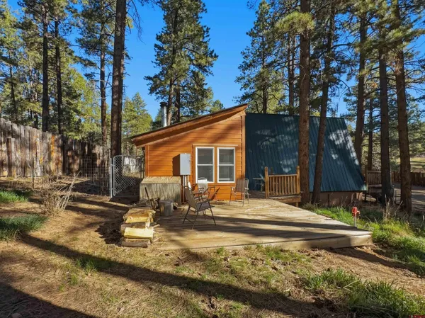 a backyard of a house with outdoor seating