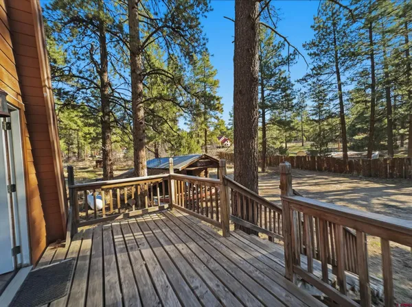 a view of a balcony with wooden floor