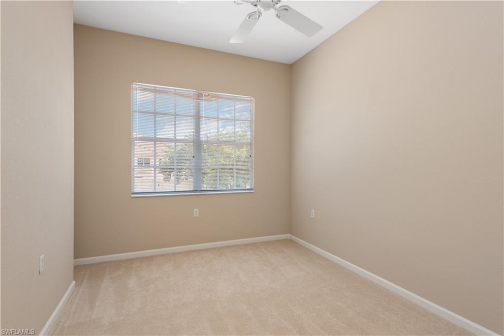 26425 Lucky Stone Road, Unit 201 Bonita Springs, FL 34135 - Photo 15 of 22 an empty room with a window