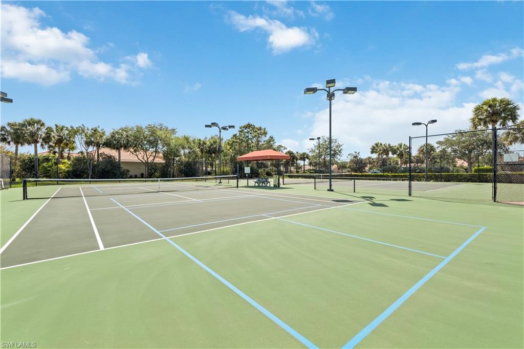 26425 Lucky Stone Road, Unit 201 Bonita Springs, FL 34135 - Photo 20 of 22 a view of a tennis court