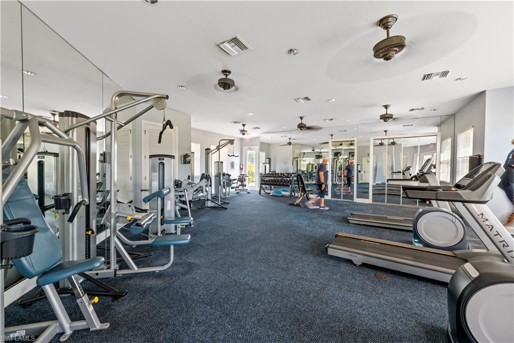 26425 Lucky Stone Road, Unit 201 Bonita Springs, FL 34135 - Photo 21 of 22 a view of a room with gym equipment