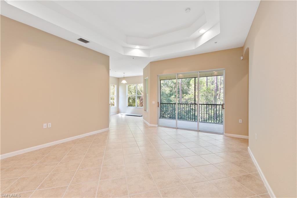 26425 Lucky Stone Road, Unit 201 Bonita Springs, FL 34135 - Photo 6 of 22 a view of an empty room with a window