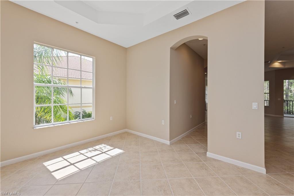 26425 Lucky Stone Road, Unit 201 Bonita Springs, FL 34135 - Photo 9 of 22 an empty room with windows