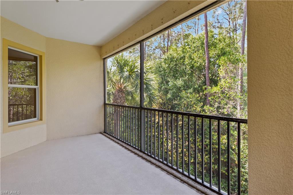 26425 Lucky Stone Road, Unit 201 Bonita Springs, FL 34135 - Photo 10 of 22 a view of a balcony with an outdoor space