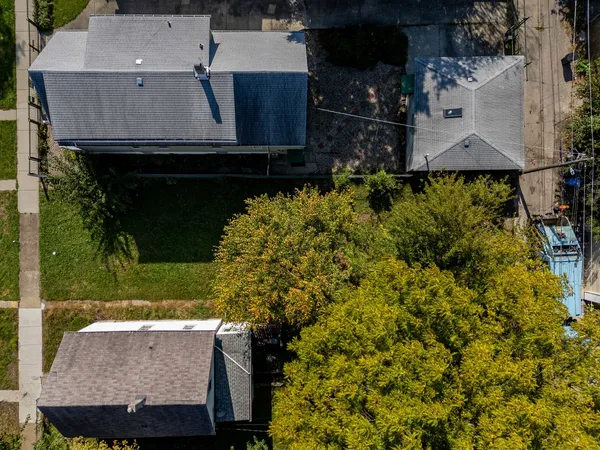 an aerial view of residential houses with outdoor space