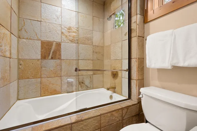 a bathroom with a bathtub and sink