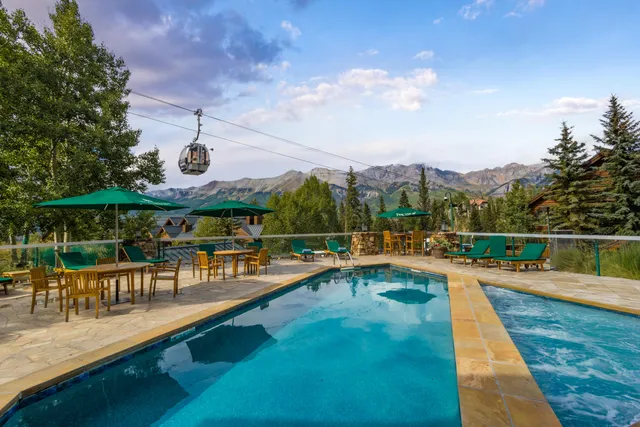 a view of a swimming pool with a patio