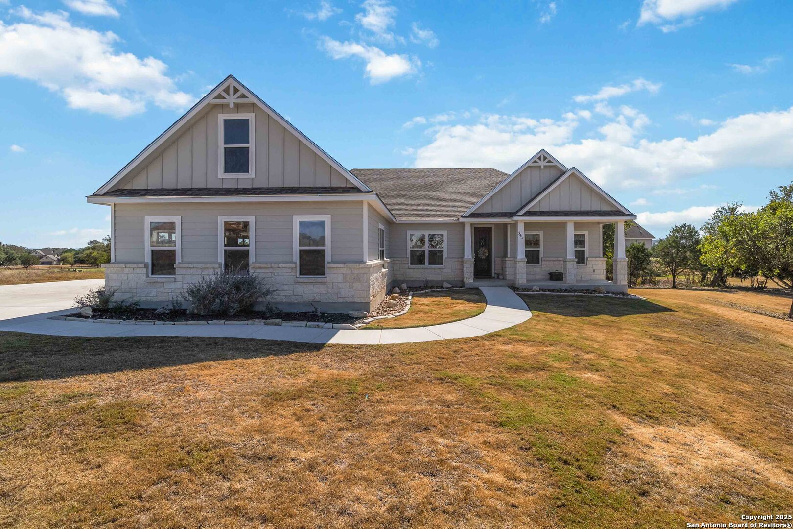 a front view of a house with yard