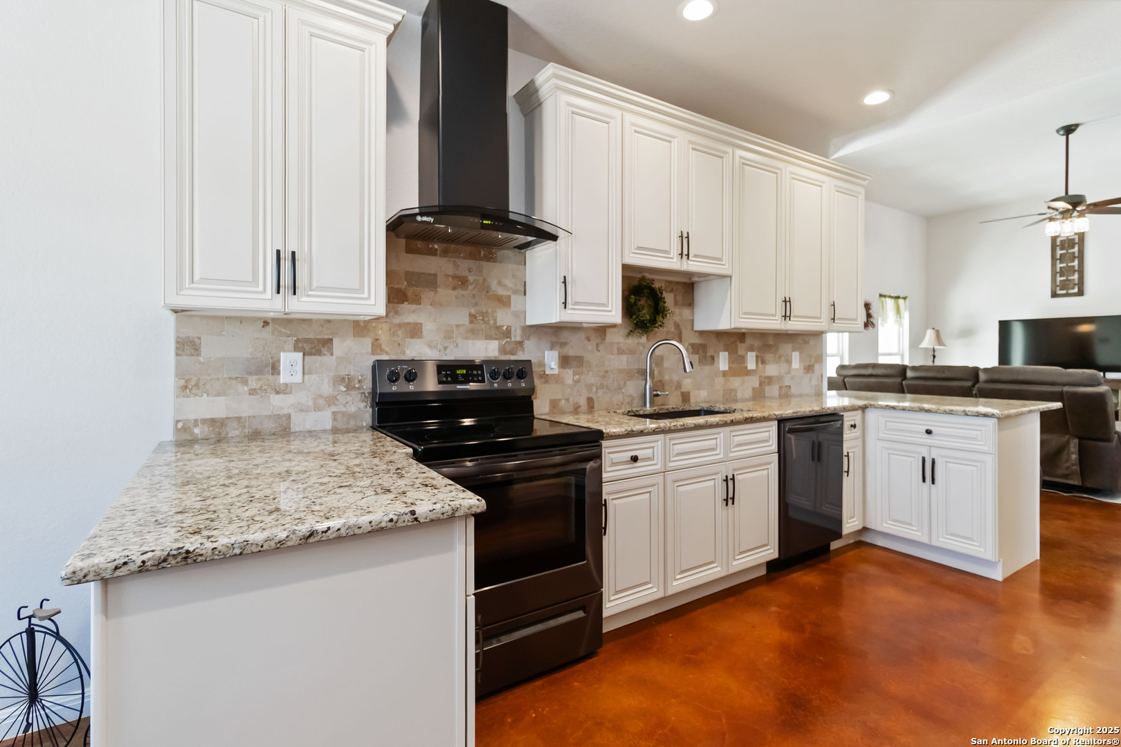 342 Wood View Circle Bandera, TX 78003 - Photo 12 of 45 a kitchen with stainless steel appliances granite countertop a stove a sink and a microwave