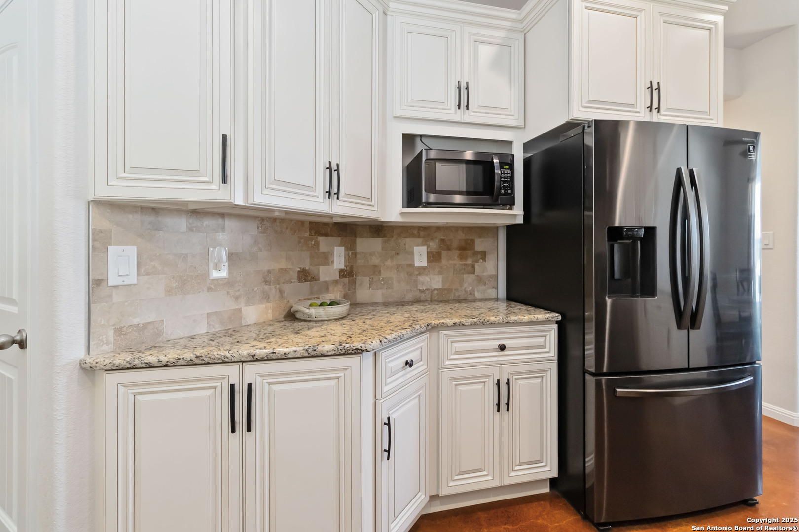 342 Wood View Circle Bandera, TX 78003 - Photo 13 of 45 a kitchen with stainless steel appliances granite countertop a refrigerator stove and white cabinets