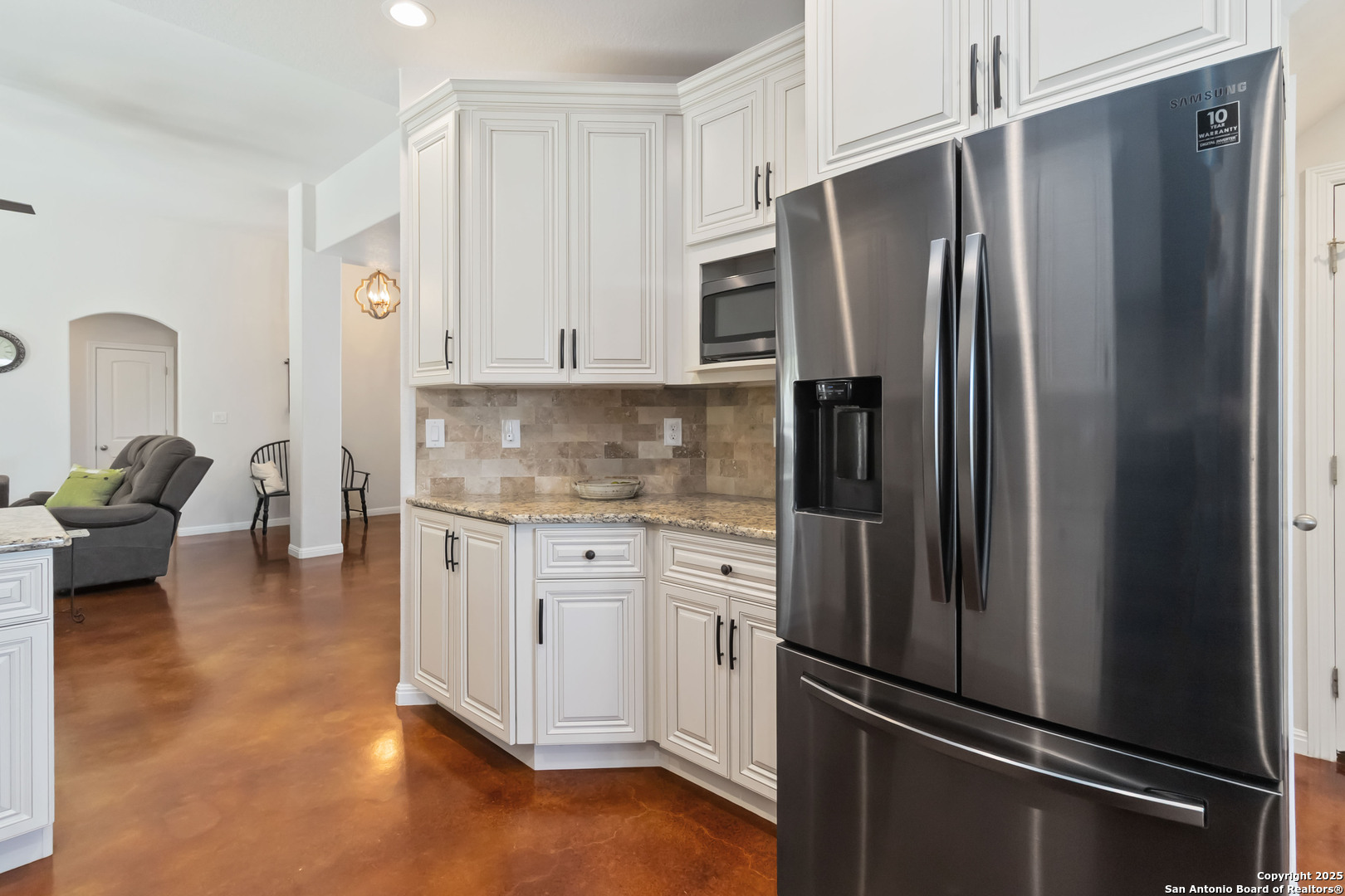 342 Wood View Circle Bandera, TX 78003 - Photo 15 of 45 a kitchen with stainless steel appliances a refrigerator sink and cabinets
