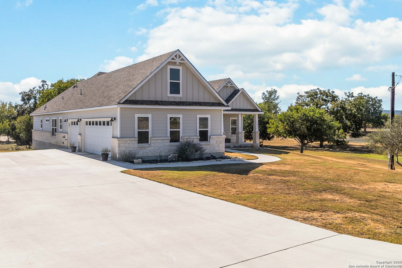 342 Wood View Circle Bandera, TX 78003 - Photo 2 of 45 a front view of a house with a yard