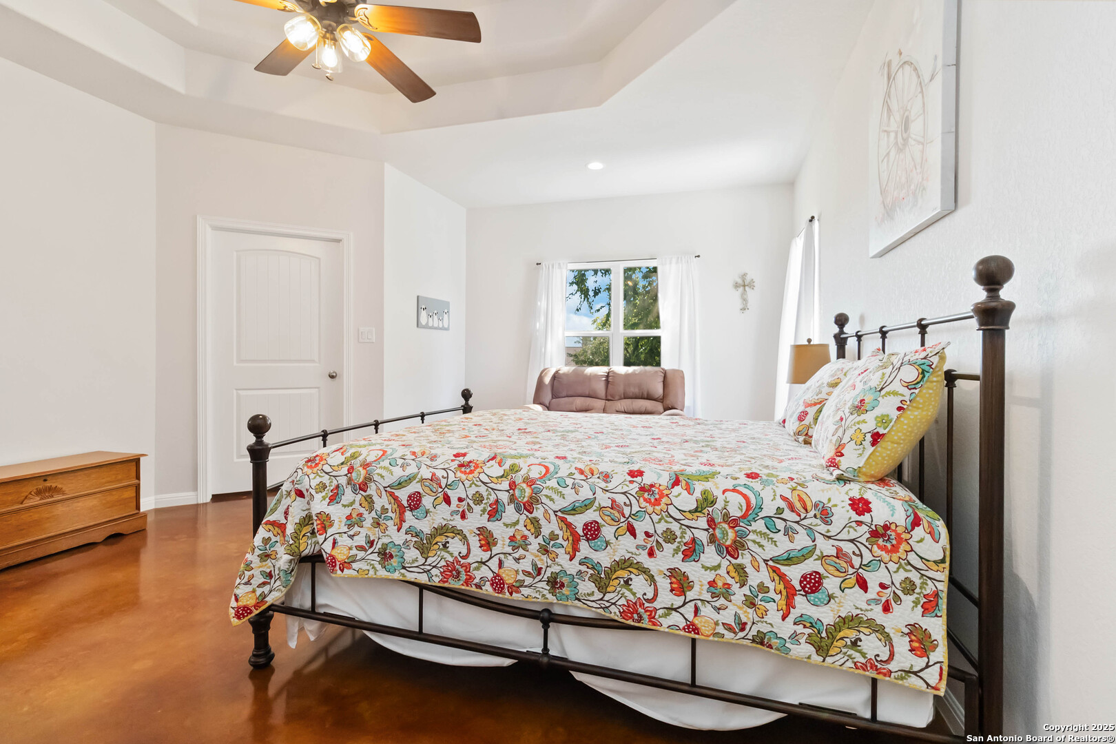 342 Wood View Circle Bandera, TX 78003 - Photo 21 of 45 a bed sitting in a bedroom next to a window