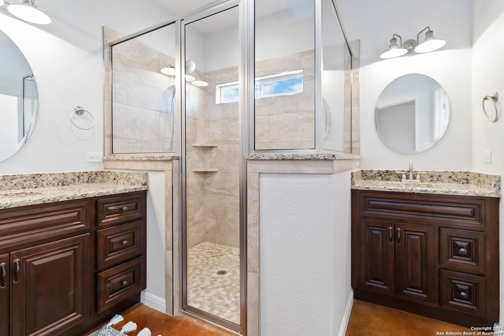 342 Wood View Circle Bandera, TX 78003 - Photo 24 of 45 a bathroom with a granite countertop sink a mirror and shower