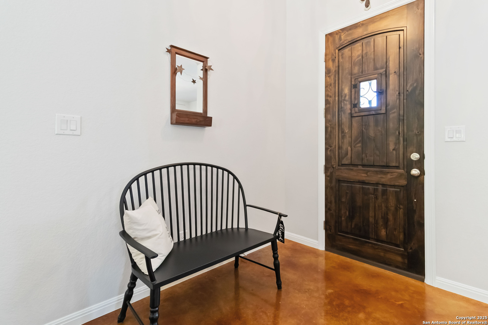342 Wood View Circle Bandera, TX 78003 - Photo 26 of 45 a view of a hallway with wooden floor and a potted plant