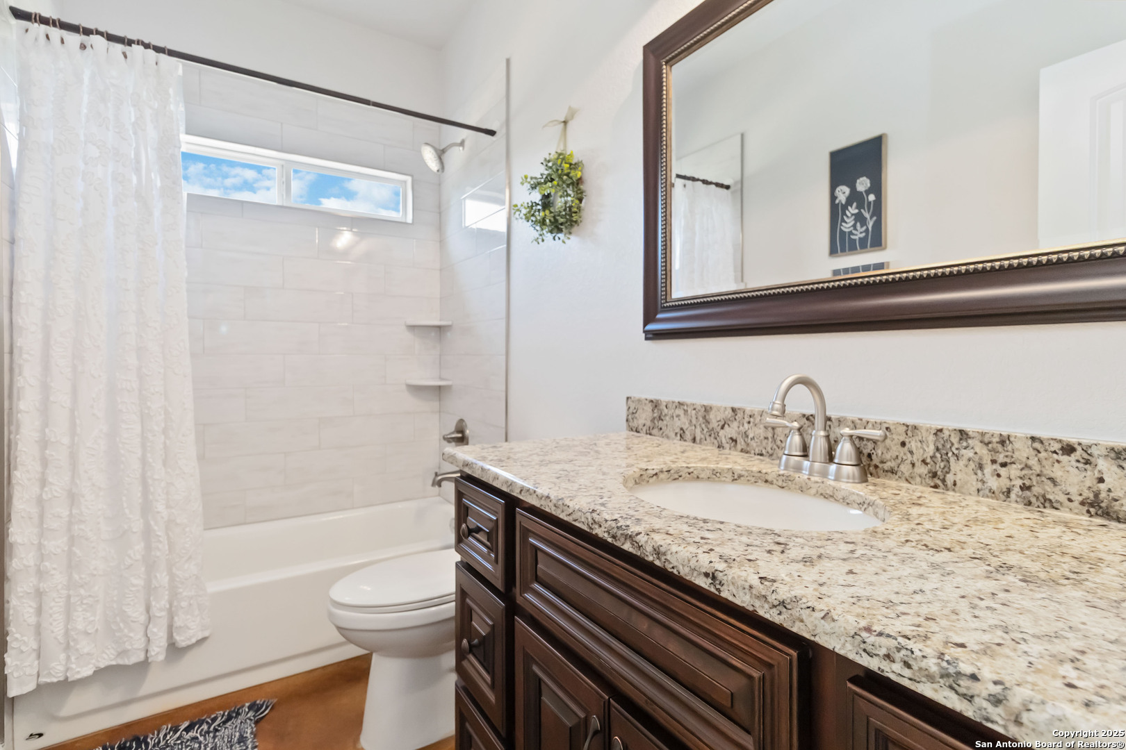 342 Wood View Circle Bandera, TX 78003 - Photo 29 of 45 a bathroom with a granite countertop sink a toilet and shower