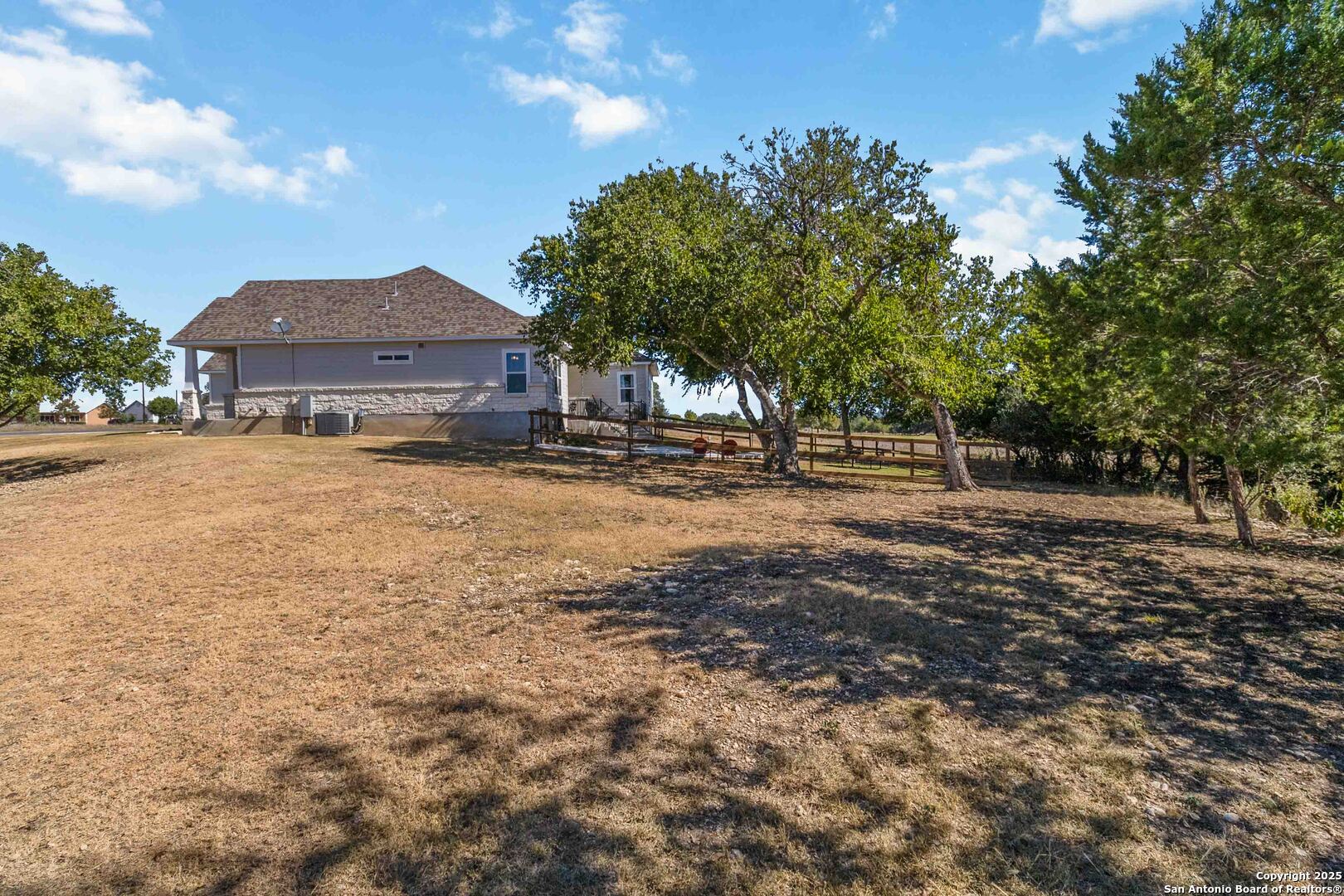 342 Wood View Circle Bandera, TX 78003 - Photo 36 of 45 a front view of a house with a yard