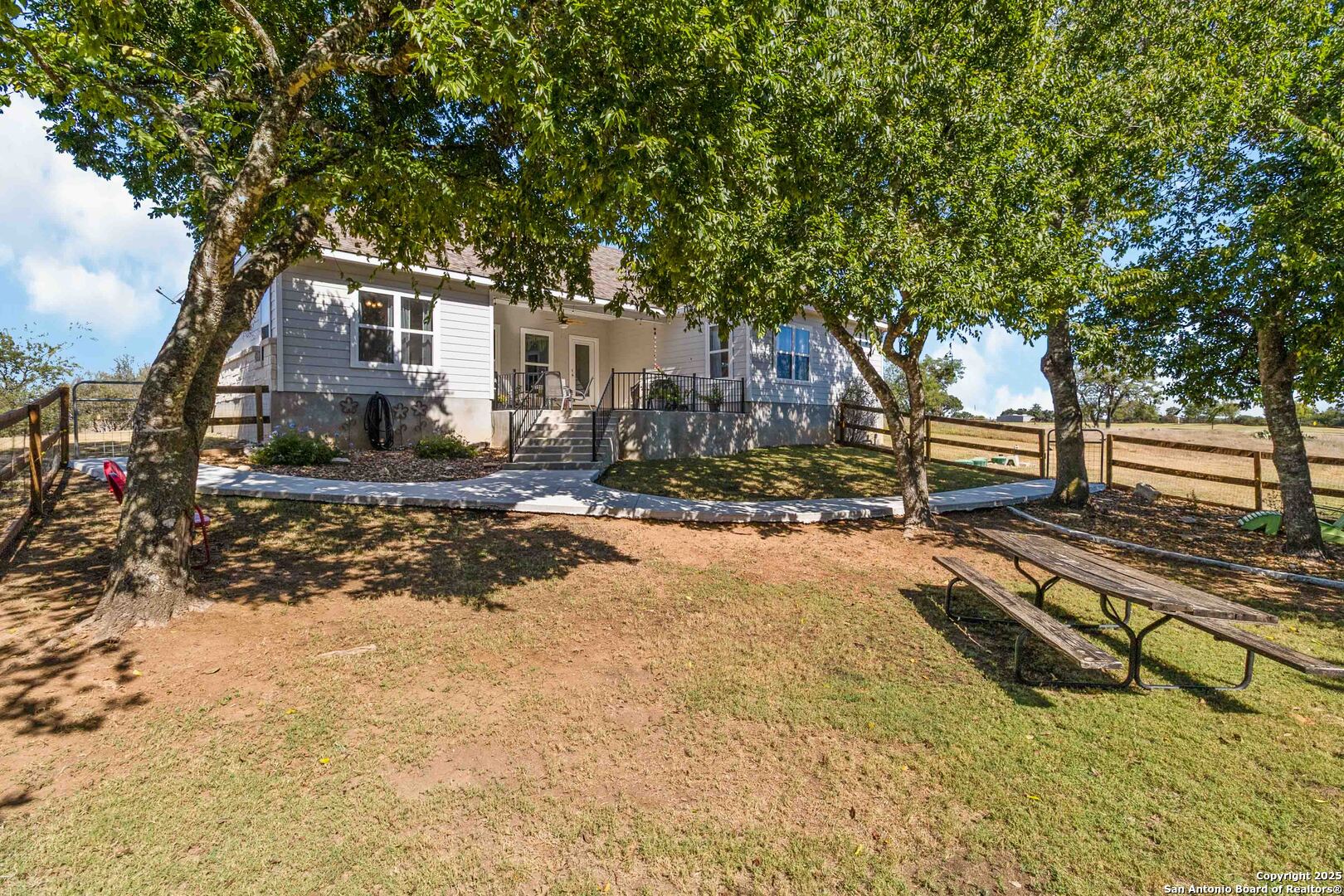 342 Wood View Circle Bandera, TX 78003 - Photo 37 of 45 a view of a backyard with large trees