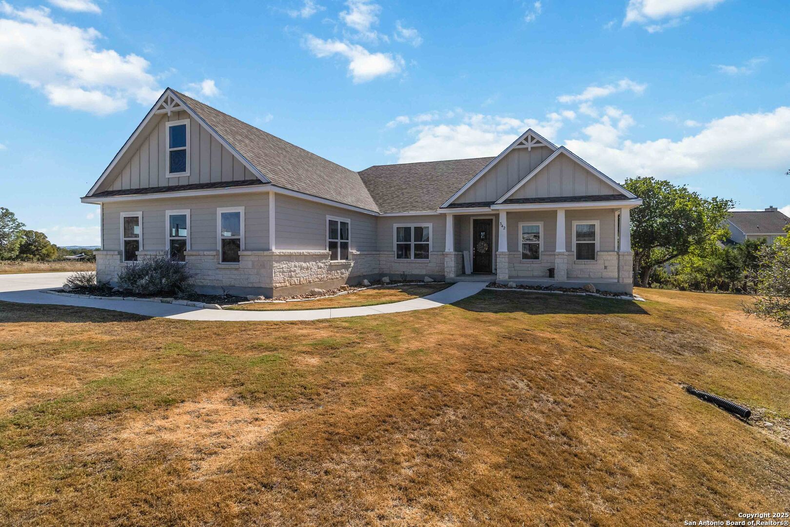 342 Wood View Circle Bandera, TX 78003 - Photo 4 of 45 a front view of a house with a yard
