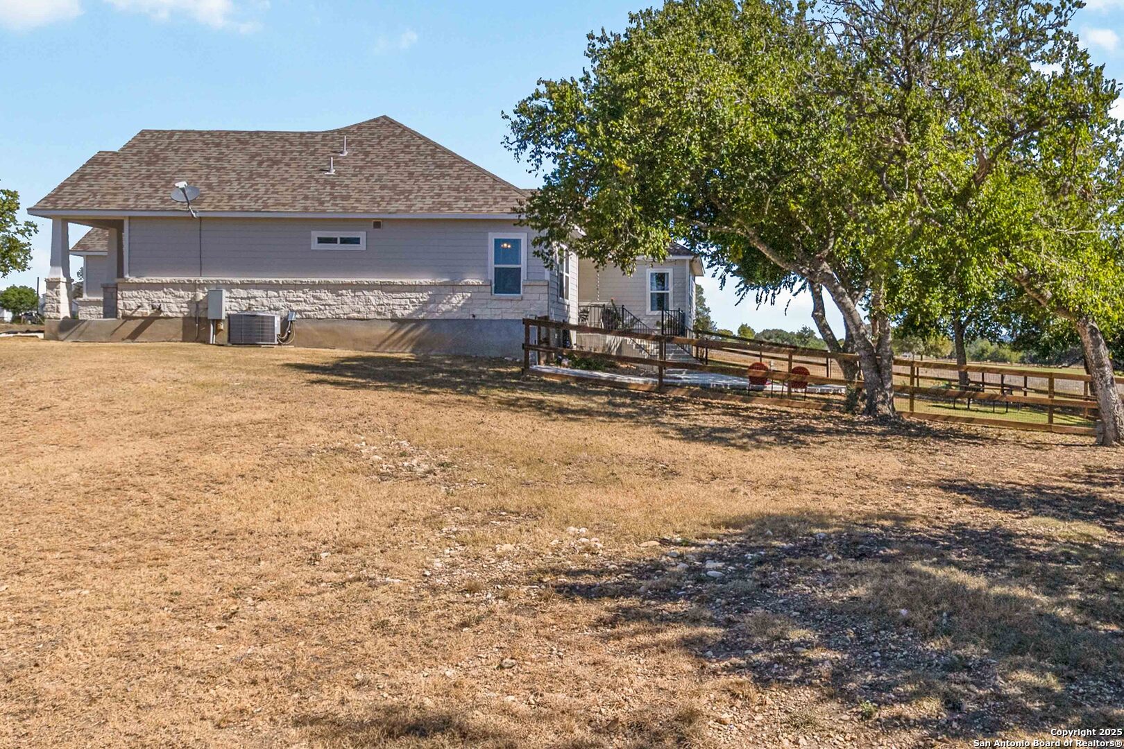 342 Wood View Circle Bandera, TX 78003 - Photo 44 of 45 a house with trees in the background