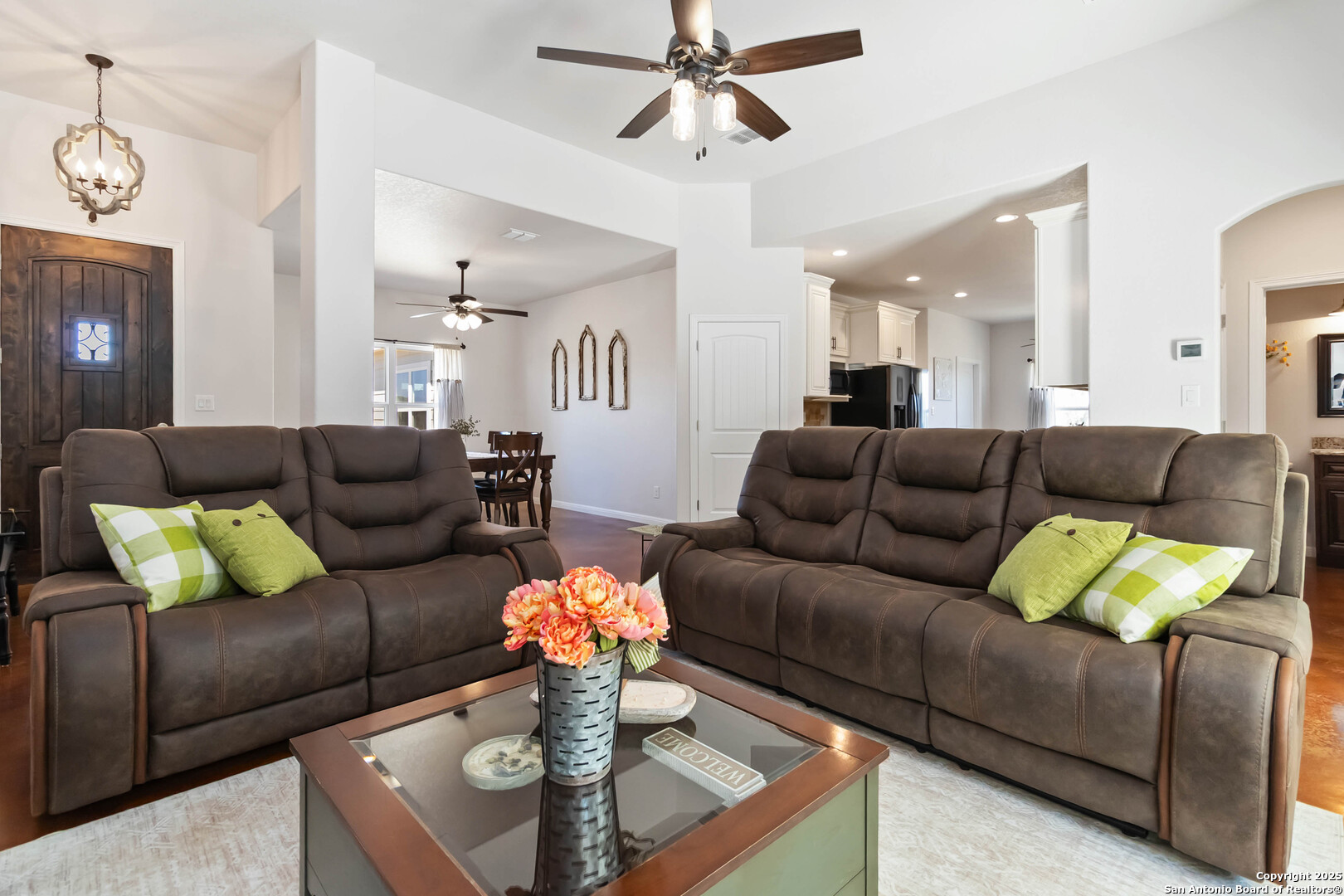 342 Wood View Circle Bandera, TX 78003 - Photo 9 of 45 a living room with furniture and a chandelier