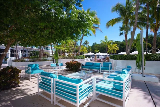 a view of a backyard with sitting area