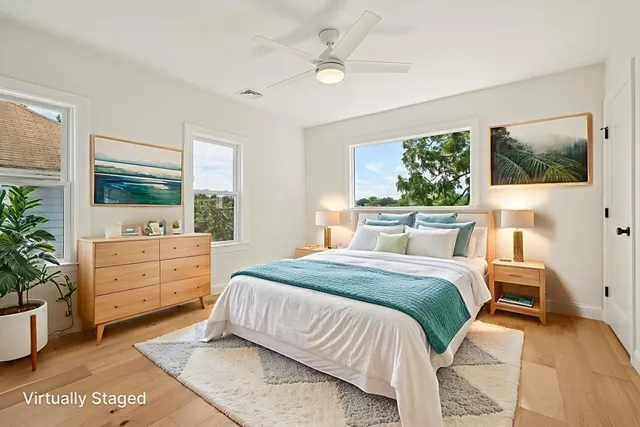 a bed room with a bed and a dresser