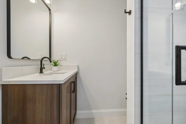 a bathroom with a sink and a mirror