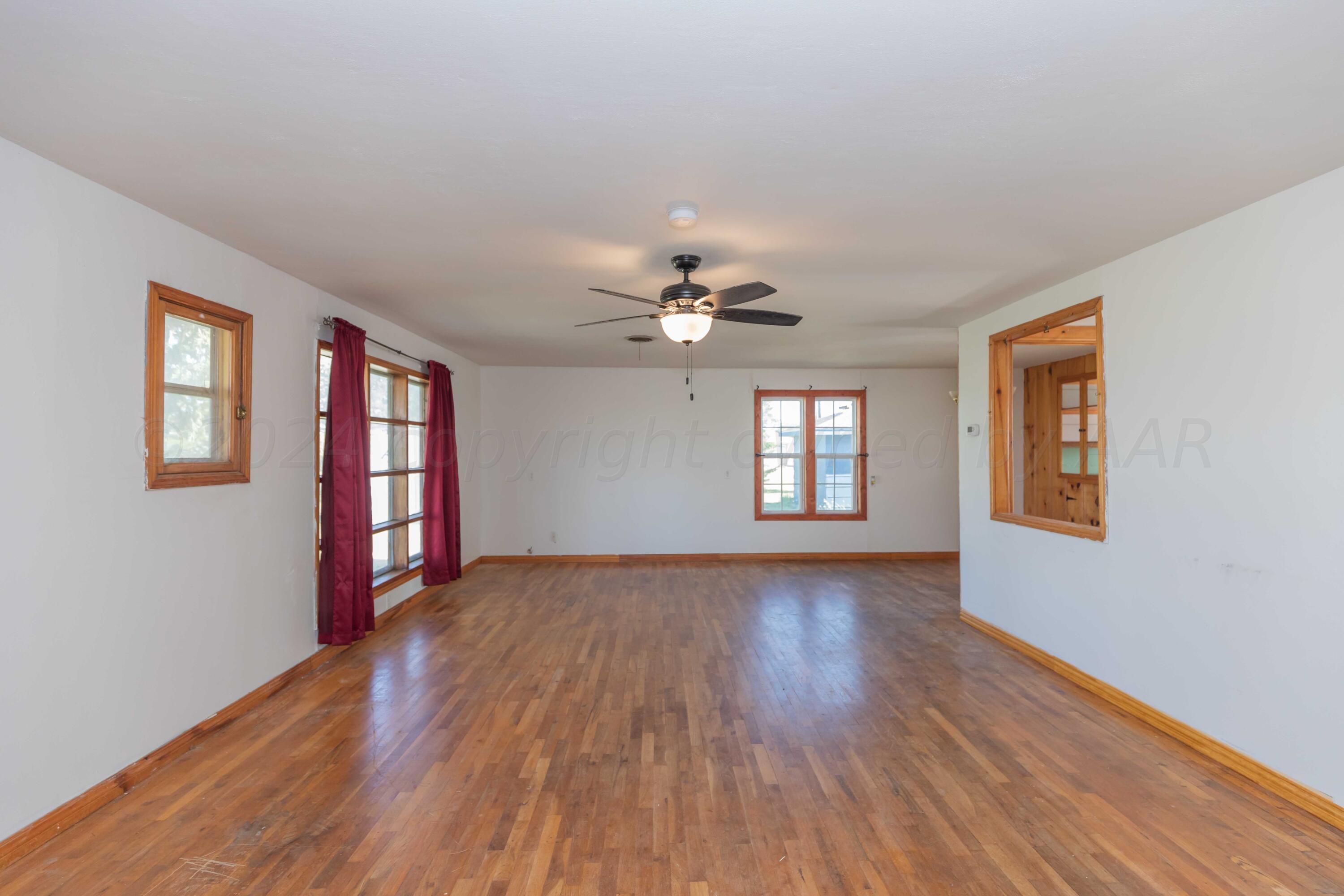 25501 Adkisson Road Umbarger, TX 79015 - Photo 5 of 34 LIVING ROOM VIEW 2