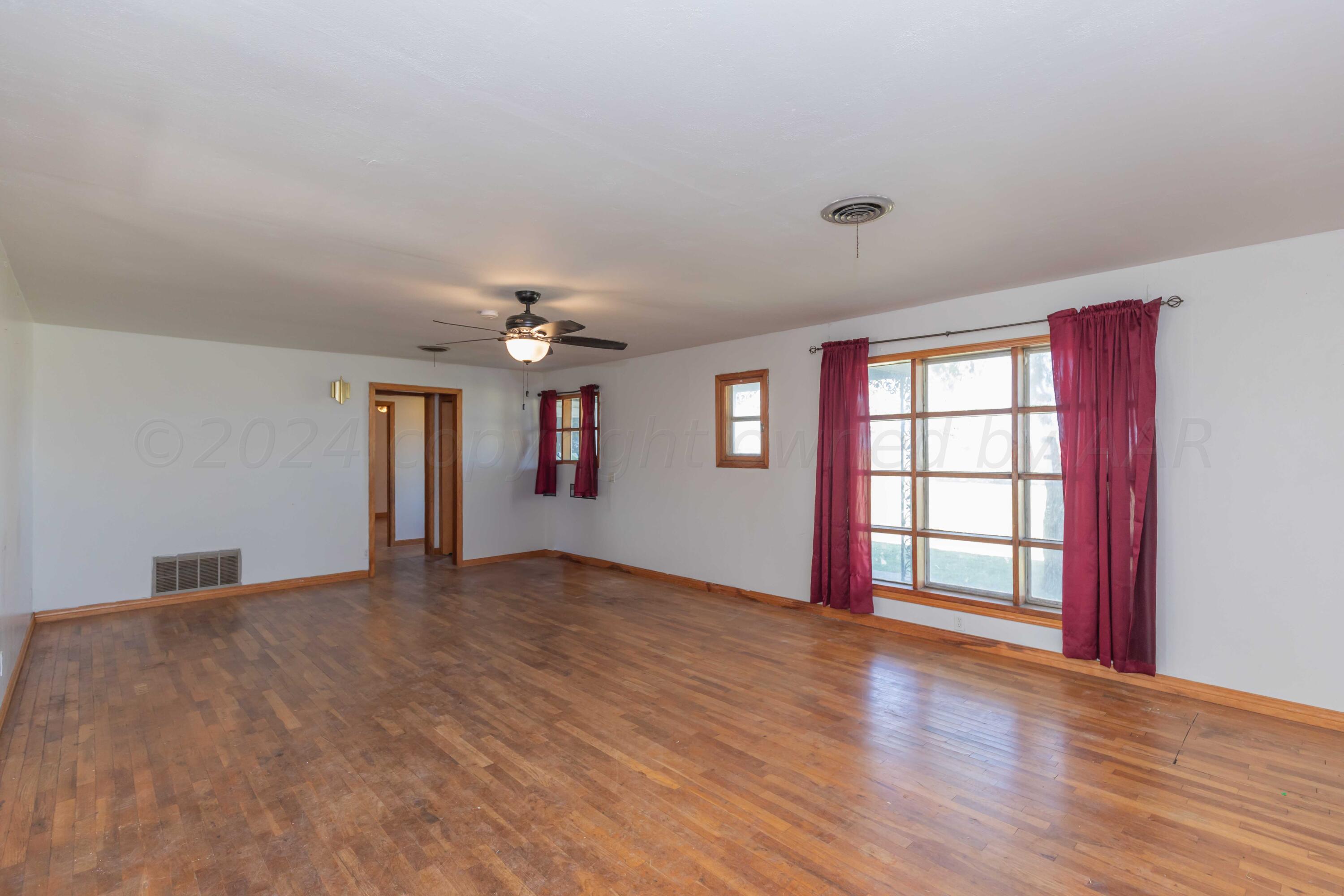 25501 Adkisson Road Umbarger, TX 79015 - Photo 6 of 34 LIVING ROOM VIEW 3
